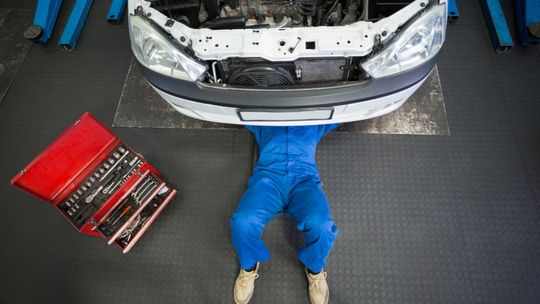 A mechanic working under a car